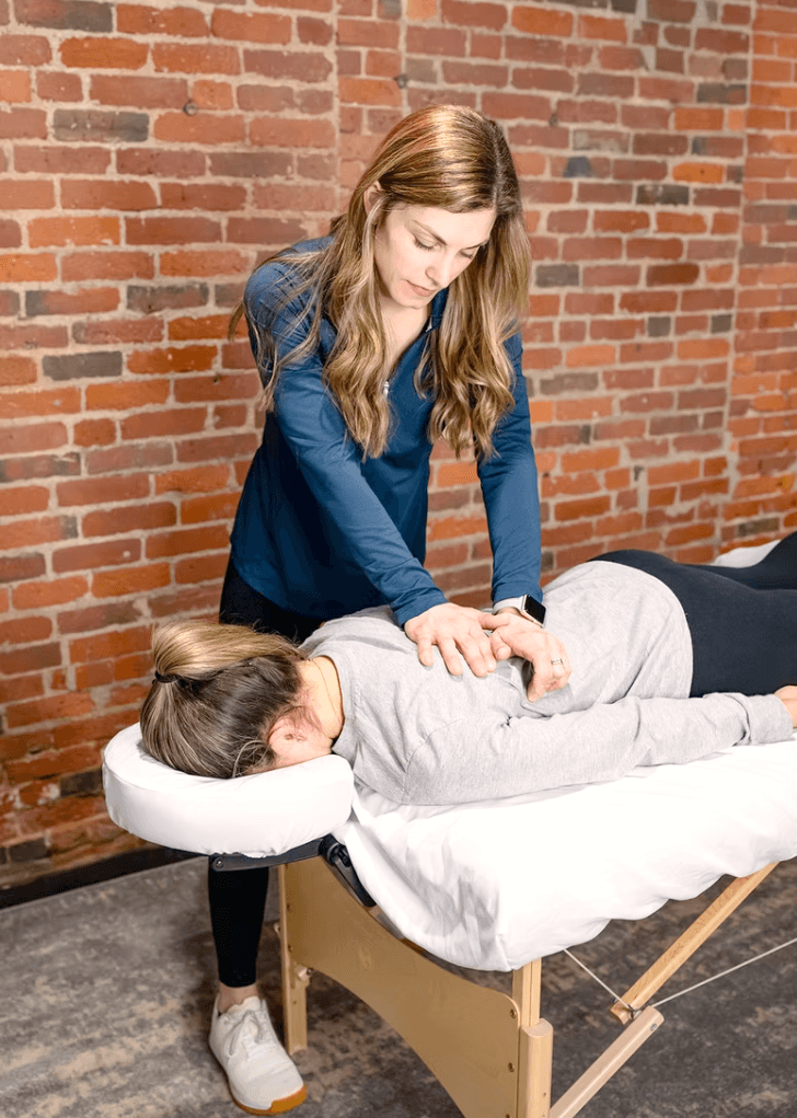 Dr. Molly Sifflard performing manual therapy on a patient